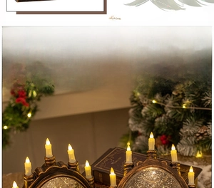 Dual arch LED crystal candle lantern with bronze finish and festive swirling glitter