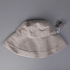 Close-up of striped cotton linen sun hat with adjustable gray windproof lanyard