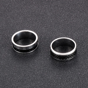 Detail of 8mm titanium steel rings with Roman numerals and carbon fiber inlay textures