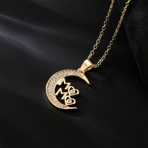 Gold 18K plated moon necklace with zircon heart and MAMA pendant on black background