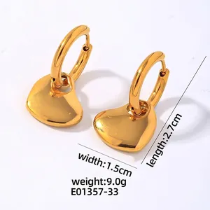 Detail view of 16K gold heart pendant earrings with 2.7cm length and 1.5cm width dimensions