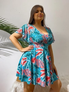 Detail of tropical palm leaf print on plus size V-neck dress with ruffled sleeves