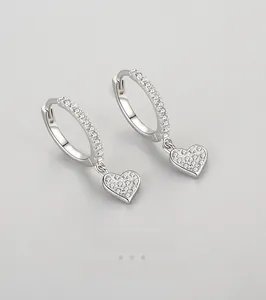 Detailed close-up of S925 silver heart drop earrings with shimmering pavé zircon stones