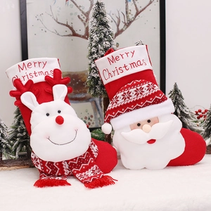 Cute knitted Santa and reindeer Christmas stockings set for holiday gifts and decor