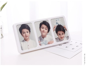 Detailed view of a triple white photo frame with three slots for personalized boy portraits