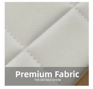 Macro shot of high-quality white quilted leather fabric with diamond cross-stitch detail