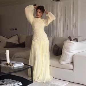 Elegant pale yellow long sleeve maxi dress with stylish pleated texture for women