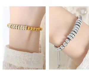 Close-up of gold and silver beaded bracelets with sparkling rhinestones and lace
