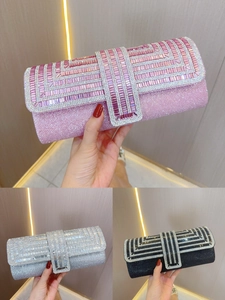 Detail of evening clutch bags with sparkling rhinestones in pink, silver and black