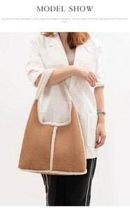 Detailed view of brown faux suede tote bag with white plush shearling trim and handles