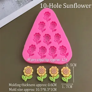 Pink silicone mold with ten sunflower cavities and yellow clay flower samples