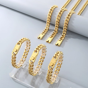 Detailed view of gold-plated Cuban link bracelets and necklaces on professional display