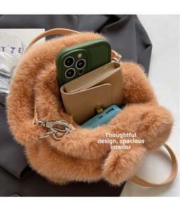 Detailed interior of plush caramel bucket bag showing spacious storage for phone and wallet