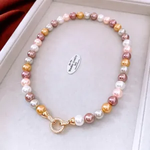 French vintage pearl necklace with multicolor beads and gold clasp in jewelry box