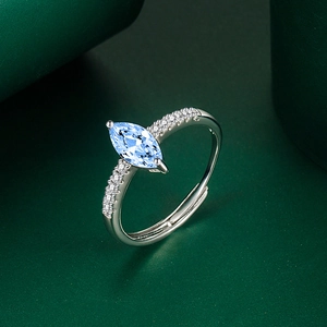 Marquise-cut blue gemstone silver ring with diamond accents and adjustable open band