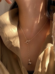 Elegant S925 sterling silver heart necklace with OT toggle clasp on a woman's neck