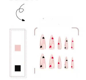 Macro detail of almond false nails with pink base, heart patterns, and rhinestone accents