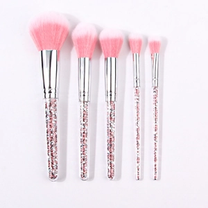 Detail of 5-piece makeup brush set with pink bristles and glittery crystal handles