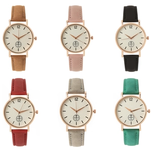 Detail view of colorful matte leather straps and rose gold cases for quartz watches