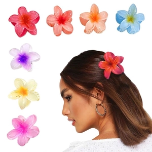 Detailed view of colorful gradient plumeria hair claws and a model wearing the flower clip
