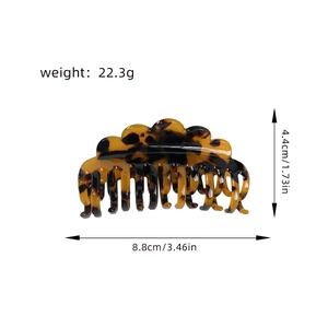 Tortoiseshell acetate hair claw clip with double row teeth and dimensions 8.8cm by 4.4cm