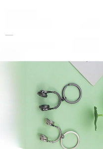 Zinc alloy headphone keychain detail showing metallic finish and durable key ring