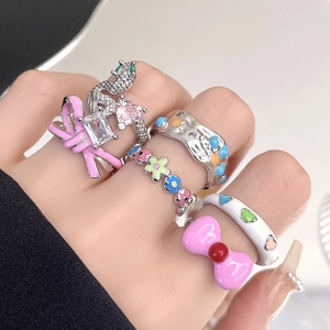 Stackable set of colorful enamel flower, snake and pink bow rings for women