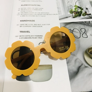Detail of yellow flower kids sunglasses with UV400 protection and CE certified lenses