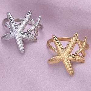 Adjustable 18K gold and silver starfish rings with realistic textured surface details