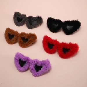 Detailed close-up of heart-shaped sunglasses in grey black brown red and purple plush frames