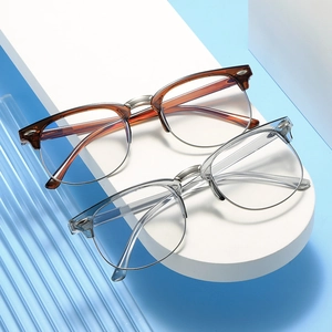 Classic half-frame eyeglasses in tortoiseshell and clear finishes on display