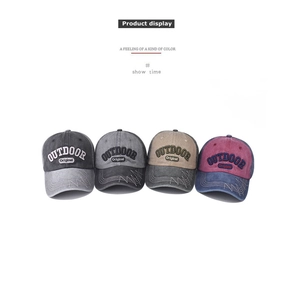Detail view of cotton baseball caps showing diverse colors and Outdoor Original embroidery