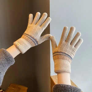 Warm beige knitted gloves with thermal fleece lining and stylish striped cuffs for winter
