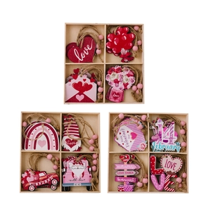 Pink wooden Valentine's Day heart ornaments set in a four-grid box for home party decor
