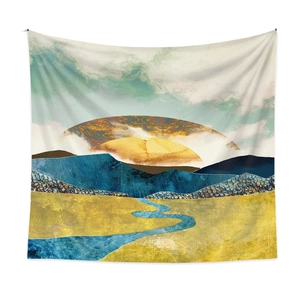 Detail of mountain tapestry showing abstract landscape print with golden sun and blue peaks