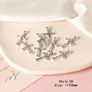 Detail of 11x20mm retro alloy cross charms for DIY jewelry making in silver finish