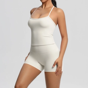 Detail of off-white brushed yoga set with spaghetti strap top and high-waist biker shorts