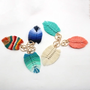 Handmade macrame feather keychains in various colors with golden metal lobster clasps