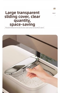Detail of cream rice storage bin showing transparent sliding lid with metal trim