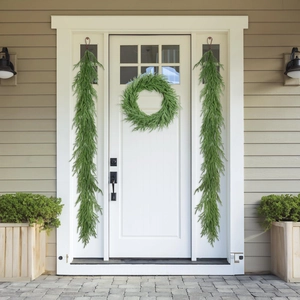 Matching Christmas garland and wreath set displayed on a white front door for home decor