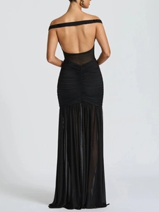 Detail view of a black backless evening dress with a slim fit fishtail cut and ruched back