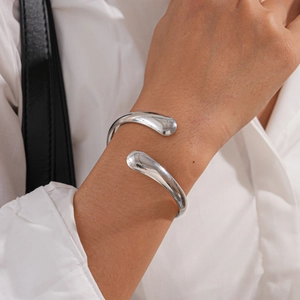 Minimalist irregular silver open bangle with polished drop-shaped ends for women