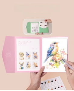 Detail of portable watercolor painting kit with animal illustrations and solid pigments