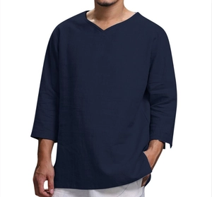Detail shot of navy blue cotton linen shirt showing V-neck and breathable fabric texture