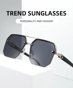 Detail of square pilot sunglasses with gray lenses and silver double bridge metal frame
