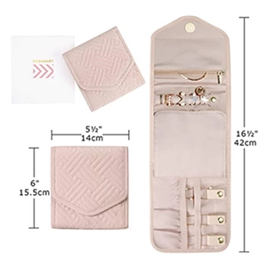 Foldable pink quilted jewelry organizer showing compact size and expanded internal storage compartments