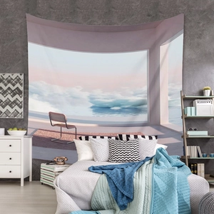 Detail of bohemian tapestry with surreal landscape hanging over a modern bedroom setup