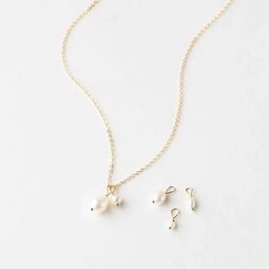 Detail of baroque freshwater pearl pendant on 14K gold plated stainless steel chain