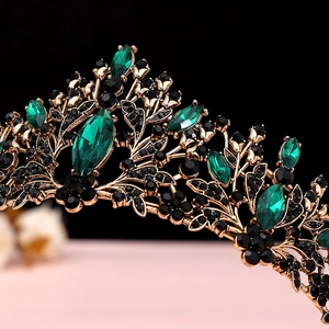 Detail of baroque tiara featuring marquise-cut green gems and black rhinestones