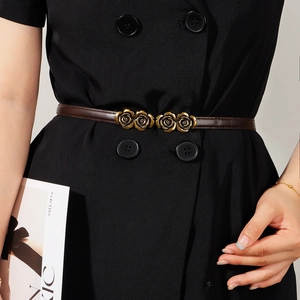 Adjustable brown skinny leather belt for women featuring a vintage gold rose buckle